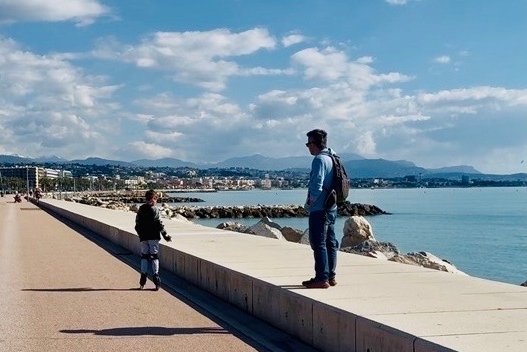 A family rollerblading along the seafront path